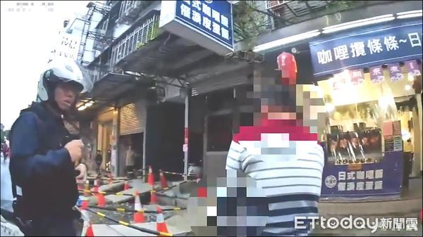 ▲張男代照料女童，遭誤解誘拐兒童，當街爆發衝突遭警員壓制管束。（圖／記者陸運陞翻攝）