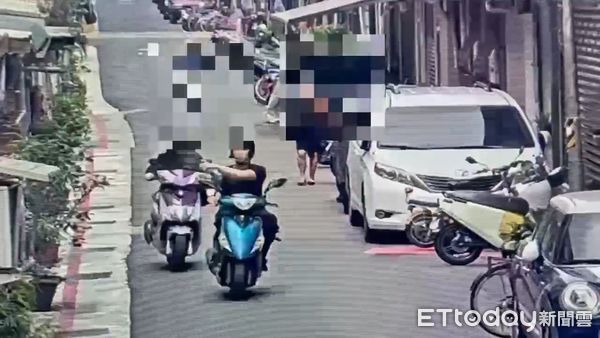 ▲北市信義區吳興街發生怪人持噴霧罐攻擊騎士的離譜案件。（圖／記者張君豪翻攝）