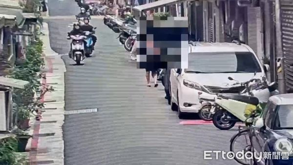 ▲北市信義區吳興街發生怪人持噴霧罐攻擊騎士的離譜案件。（圖／記者張君豪翻攝）