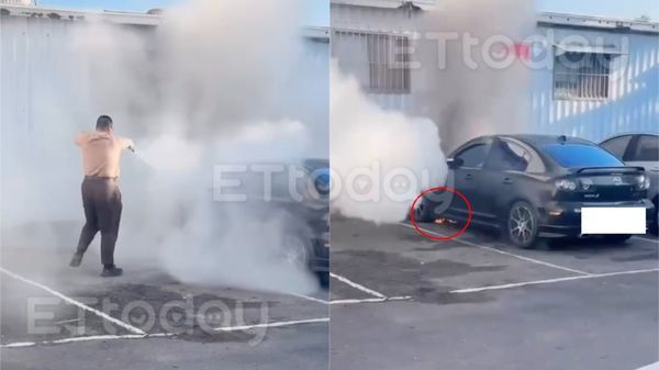 ▲高雄市立殯儀館旁的禮儀社停車場發生火燒車，工作人員協助滅火            。（圖／民眾提供）