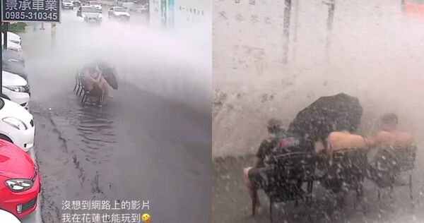 花蓮一間車行年輕人因為豪大雨在路邊玩起雨水。（圖／翻攝自Threads@alan_8190）