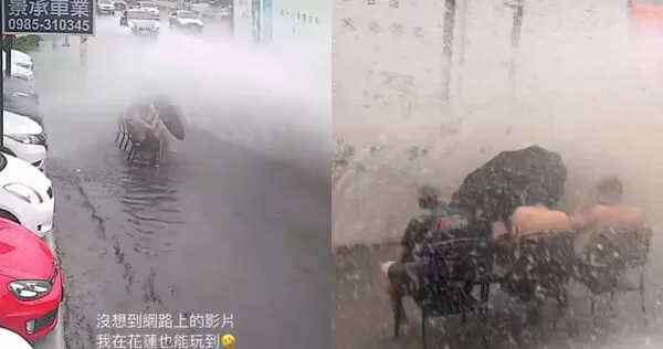 花蓮一間車行年輕人因為豪大雨在路邊玩起雨水。（圖／翻攝自Threads@alan_8190）