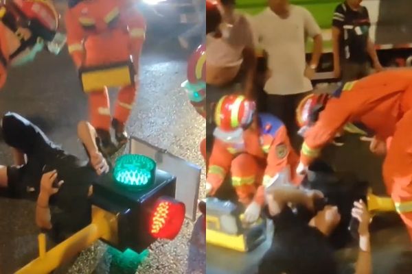 ▲▼騎士出車禍，頭撞進紅綠燈裡面。（圖／翻攝微博）