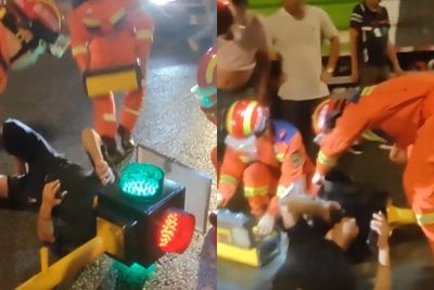 騎士撞上紅綠燈「頭卡進燈罩」!躺地等救援號誌還在閃