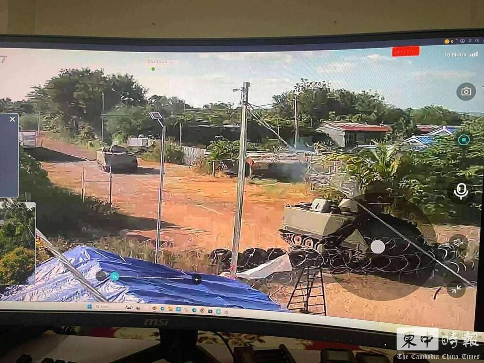 ▲▼ 柬埔寨前線監視器畫面顯示，泰軍裝甲車越境逼近柬埔寨村莊，武裝人員在民宅附近活動。。（圖／翻攝自柬中時報）