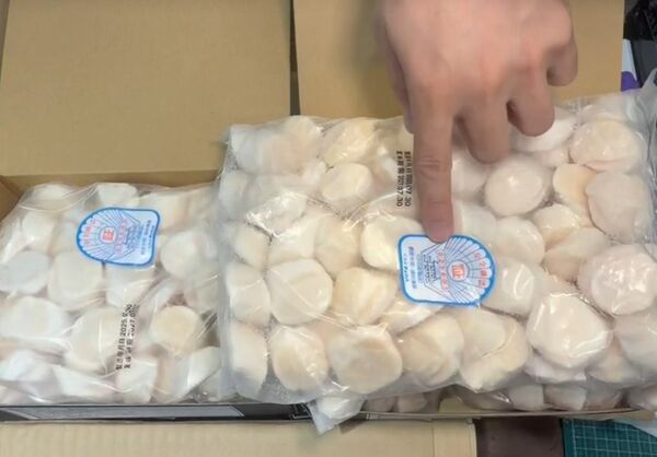 ▲彰化水產業者售出珍貴的橘色干貝(赤玉干貝)。（圖／記者唐詠絮翻攝）