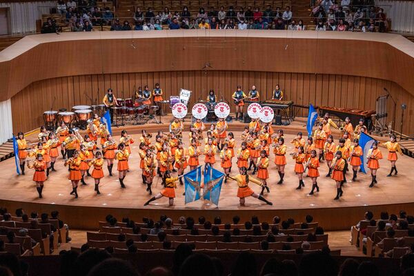 ▲▼被封為「橘色惡魔」的日本京都橘高校吹奏樂部，以及「翡翠騎士」東京農大二高吹奏樂部，昨天（21日）結束在台灣一系列的演出。（圖／文總提供）