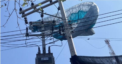 美滑翔傘客受困泰國「高壓電線桿」！　全島停電1小時成功救援