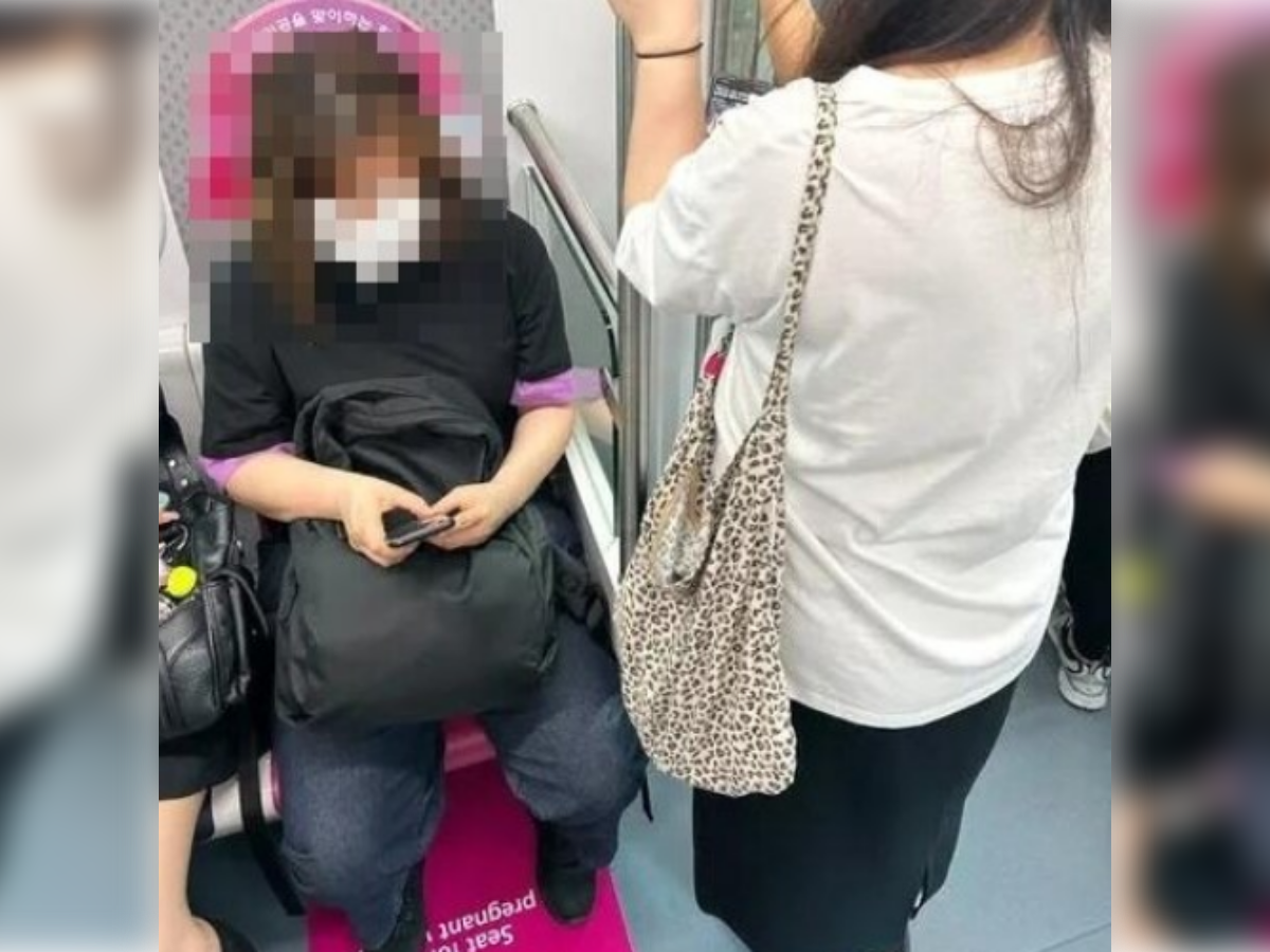 ▲▼首爾地鐵，一名孕婦要求眼前中年婦女讓出孕婦專用的博愛座。（圖／翻攝自韓網）