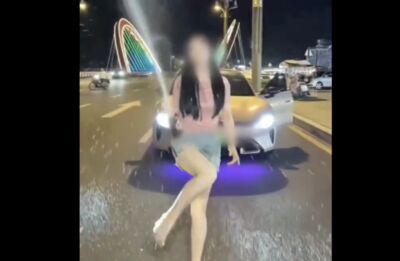 短裙辣妹路邊違停帥氣開酒拍片 公安直接叫來開單罰站聽訓
