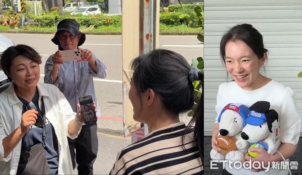 ▲民眾專程在診所門口等陳幸妤，秀出桌布是陳幸妤抱著史奴比開懷大笑的照片。（圖／記者林東良攝）